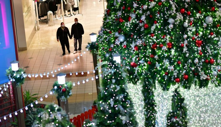 Many Americans plan to spend less this holiday season as Covid lingers

