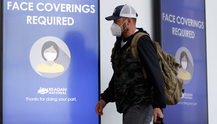 Scientists urge the Biden administration to require N95 masks in high risk workplaces

