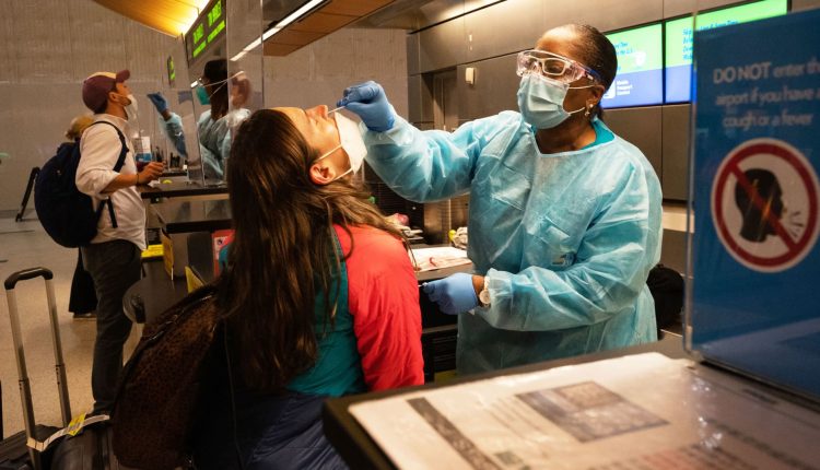 Biden will end vaccination mandates for federal employees and travelers

